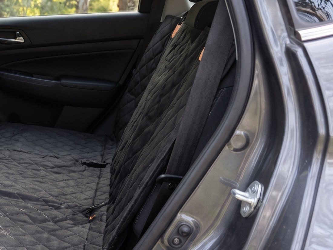 A door flap zipped up beside the back seat